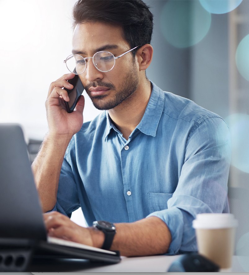 A sales leader talking to Prelude on his phone